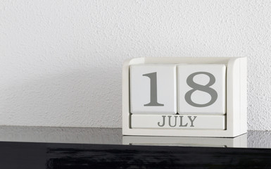 White block calendar present date 18 and month July