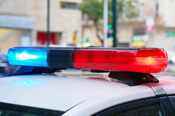 Close-up of the blue and red lights on top of a police vehicle