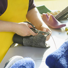 Handmade shoes. The process of making fashionable and stylish shoes from natural felted wool. - 193920083