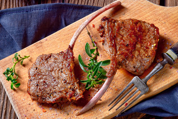 Grilled lamb chops an old board