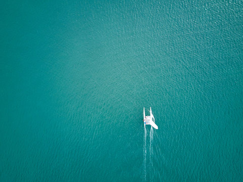 Aerial View. Top view of sport catamaran sailing in a tropical b
