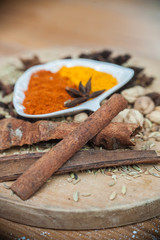 Various spices and herbs on wooden table