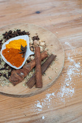 Various spices and herbs on wooden table