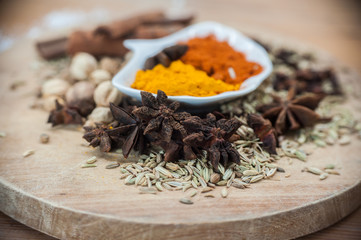 Various spices and herbs on wooden table