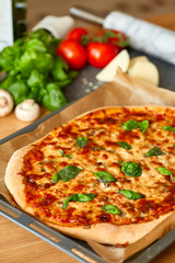 Homemade Margarita Flatbread Pizza with Tomato and Basil.