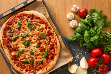 Homemade Margarita Flatbread Pizza with Tomato and Basil.