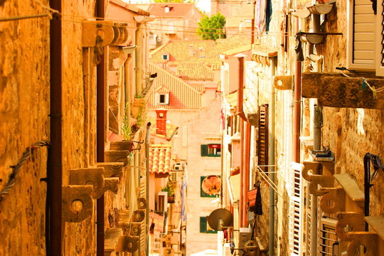 Old stone street in Dubrovnik, touristic destination in Croatia, warm colors, retro style