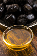 Close up of black olives and olive oil