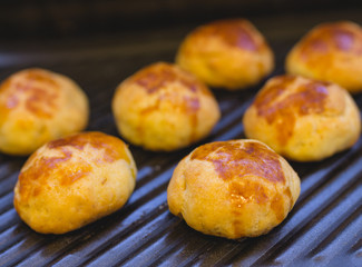 Homemade traditional savory pastries on baking tray