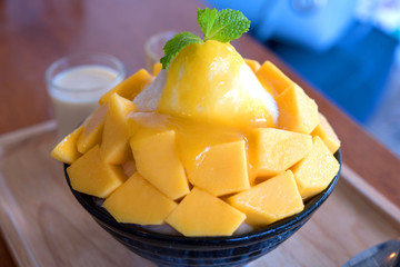 Bingsu ( Korea food) mango served with sweetened condensed milk