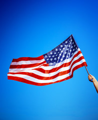 American flag holding in hand