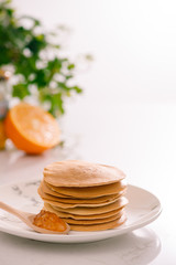 Cooking for breakfast. Delicious homemade pancakes on a plate