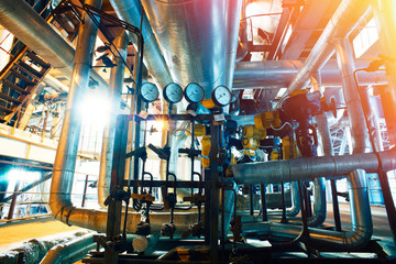 Equipment, cables and piping as found inside of a modern industrial power plant