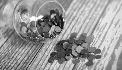 Coins in a jar on the floor. Accumulated coins on the floor. Sav