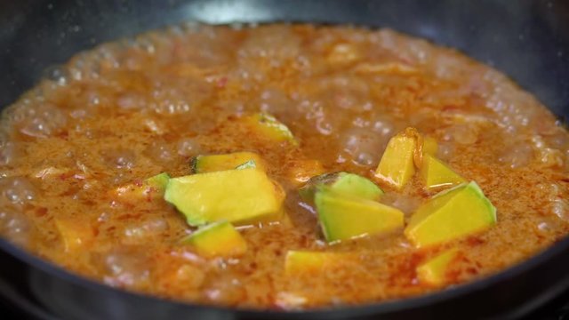 Cooking spicy pumpkin soup with pork, Thai food
