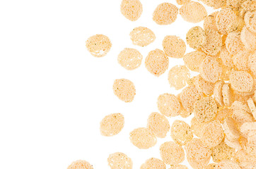 Beige croutons with spices as decorative border, copy space, isolated on white background.
