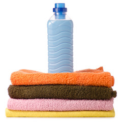 A stack of towels liquid powder conditioner softener