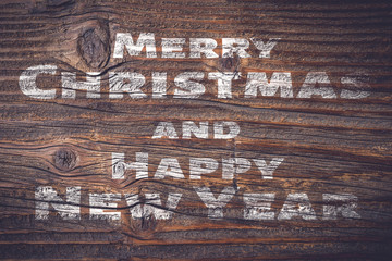 Christmas wishes on an old wooden plank. 