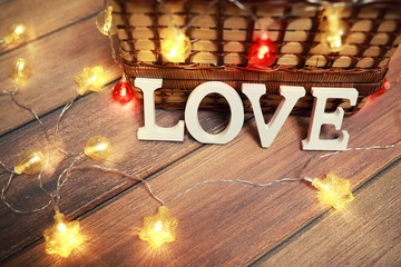 word Love from wooden letters on background