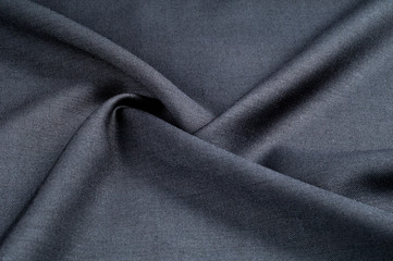 Background texture, pattern. cloth wool suit gray. A genuine flannel is always made of carded yarn,...