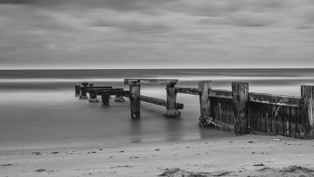 The old Mentone Beach Jetty in black and white