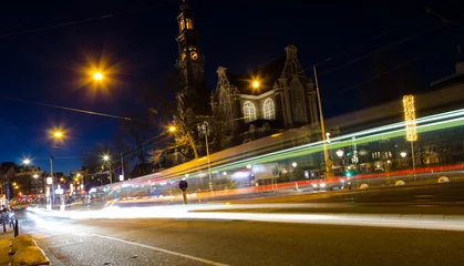Fotobehang The busy Amsterdam street at night. © noskaphoto