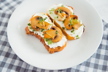 toast with cream cheese fried mushrooms and sprout
