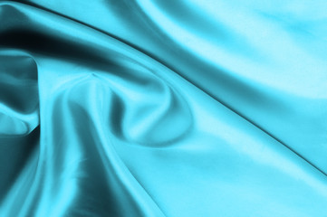 Soft focus. texture, pattern. blue silk fabric. Its deep blue flicker with a white overtones create...