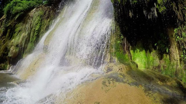 Waterfall close-up at Kwae Noi river. Sai Yok National Park, Kanchanaburi, Thailand. Travel to Asia.