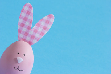 Cute pink  Easter bunny made of an egg