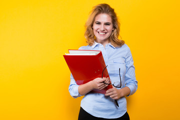 Fototapeta premium Smiling woman with big folder