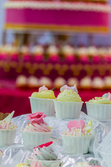 Sweet wedding cupcakes./ Sweet beauty flower and topping pastel color on wedding cake decoration.