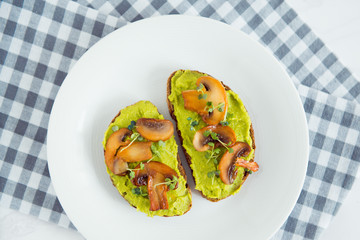 toast avocado and fried mushrooms with bean sprouts