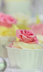 Sweet wedding cupcakes./ Sweet beauty flower and topping pastel color on wedding cake decoration.