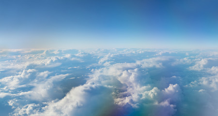 Fototapeta na wymiar Beautiful sunset with cloudy sky from the airplane window.
