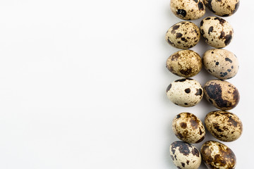 Fototapeta premium Quail eggs on white background. Organic product.