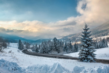 Fototapeta premium Nice mountains view in snowy sunny day under blue sky with sun l