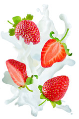 Flying strawberries with a spray of milk