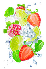 Flying Strawberry and Lime slices with a spray of water and mint leaves