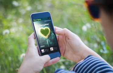 woman planning honeymoon with smartphone