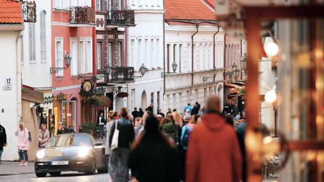 Vilnius, Lithuania. People Walking On Pilies Street Of Old Town In Autumn Day