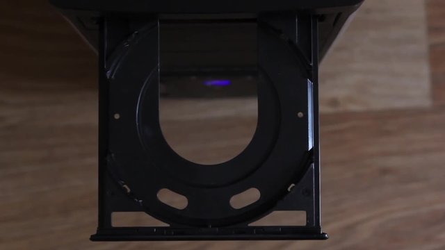 Inserting a blank CD or DVD into a laptop computer