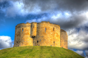 Fototapeta na wymiar York UK Clifford`s Tower tourist attraction 13th century medieval castle in colourful HDR