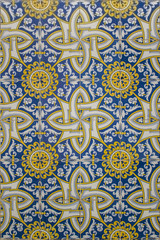 blue and yellow portuguese mosaic made of ceramic tiles