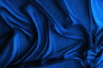 Texture, background, pattern. Blue transparent fabric. Crystal organza has a grainy shine and feel...