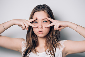 Fototapeta premium Beautiful brunette woman showing dancing gesture