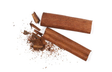 Cinnamon sticks with shavings isolated on white background, top view