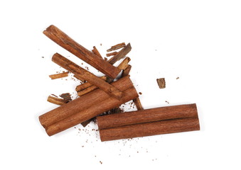 Cinnamon sticks with shavings isolated on white background, top view
