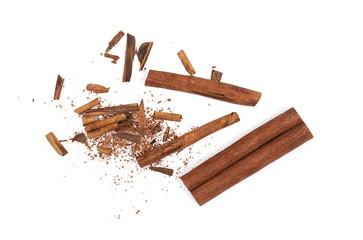Cinnamon sticks with shavings isolated on white background, top view