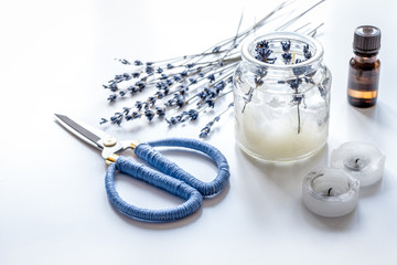 handmade candles with lavender on white background